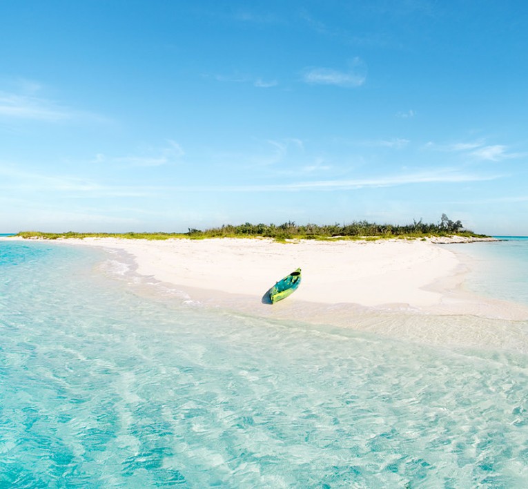 kayak on a small island's shore surrounded by water