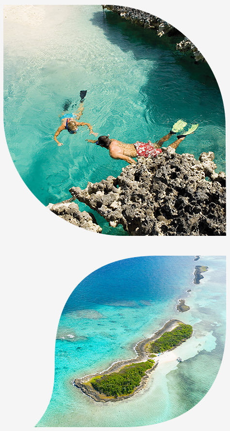 Couple snorkeling and aerial view of an island