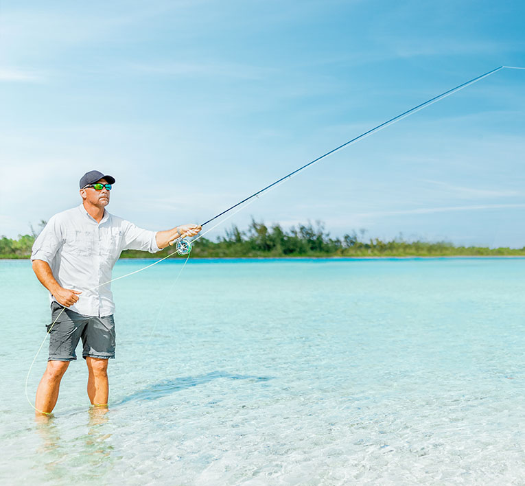 a man fishing in the ocean 