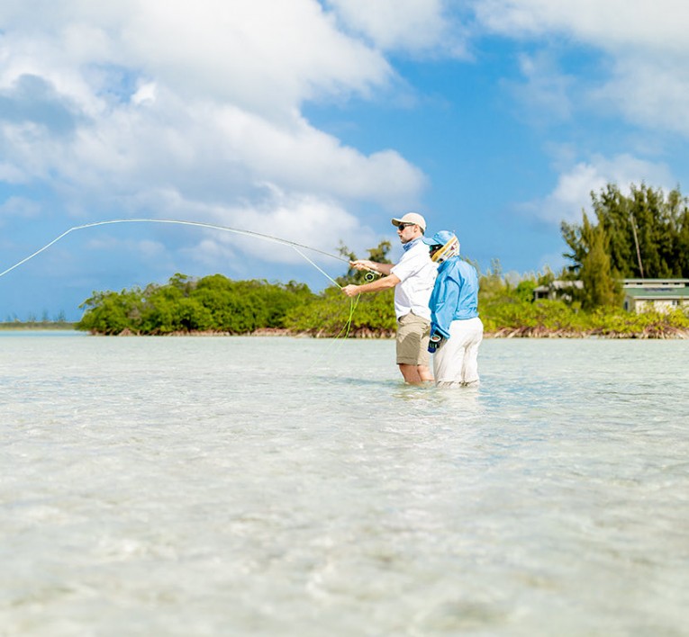 Couple fishing on flat water in Cat Island