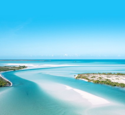 a beach with blue water