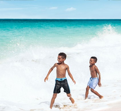 two men running on a beach