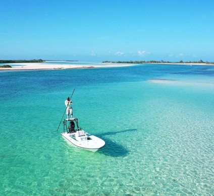 a man on a boat in the ocean