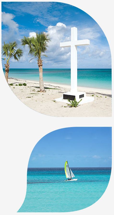 large white cross on the beach next to palm trees in the top image and sailboat in the ocean in the bottom image