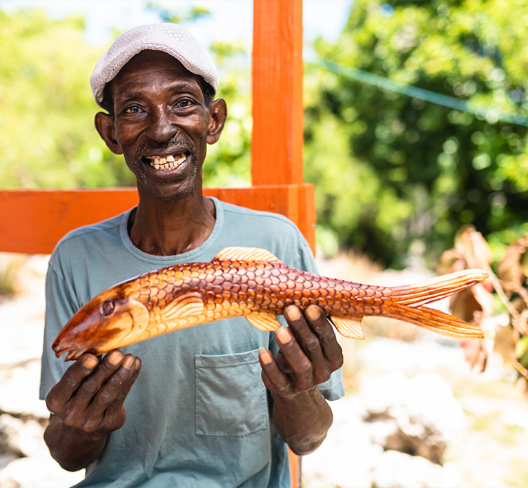 a man holding a fish