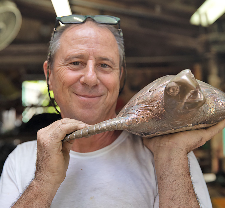 Man holding brass Turtle design